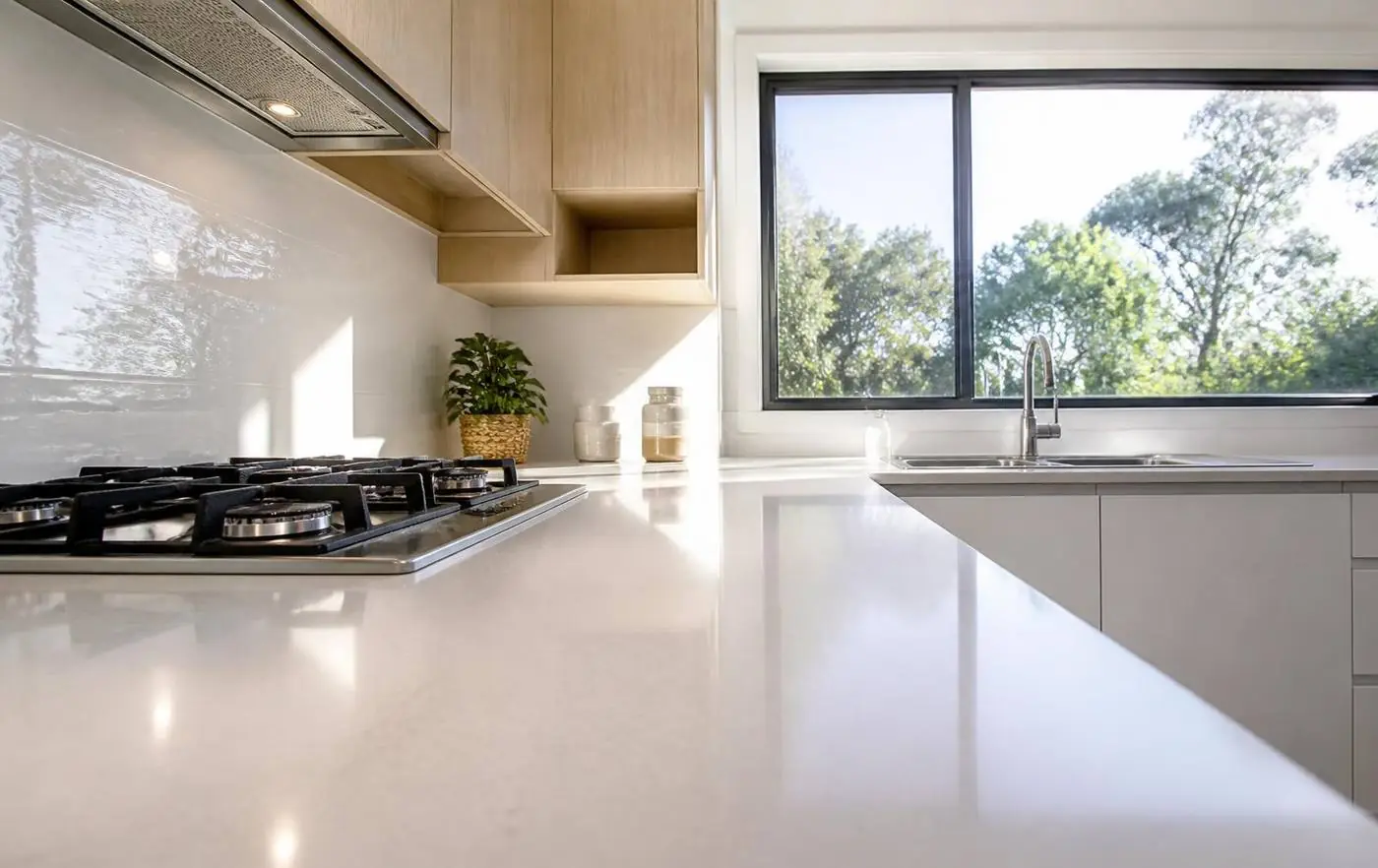 Clean kitchen benchtops and oven in a tidy rental home